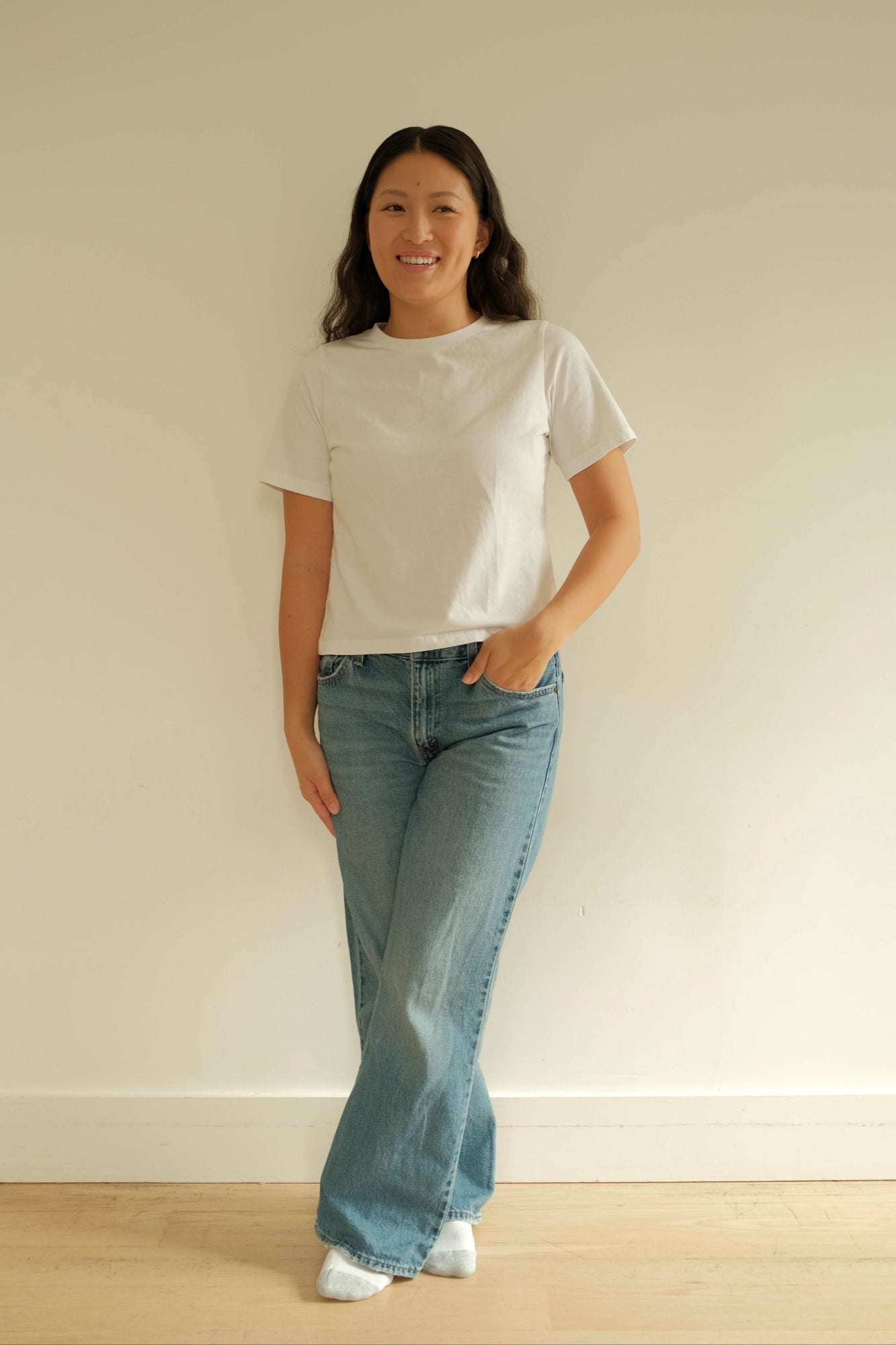 michelle wears a plain white t-shirt in the short sleeve and a size small